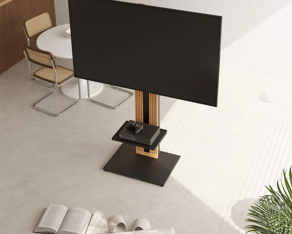The black shelf on the television stand